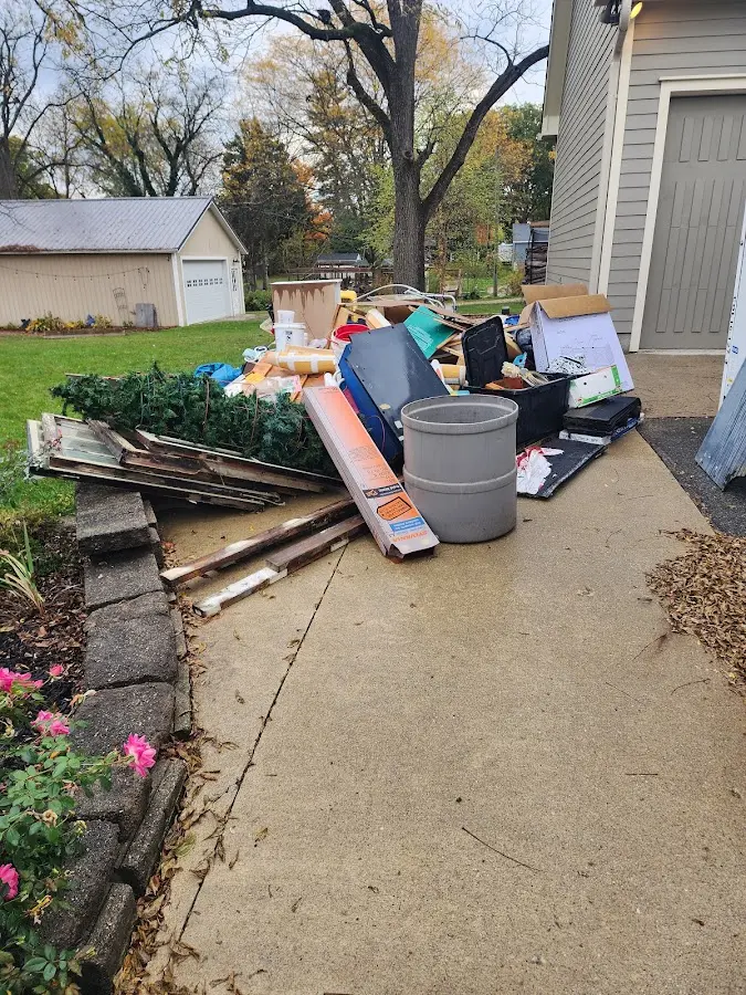 Dumpster being loaded with debris for 3 Yard Dumpster Rental in Fabius